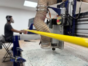 Amit using the CNC Machine at Fablab.